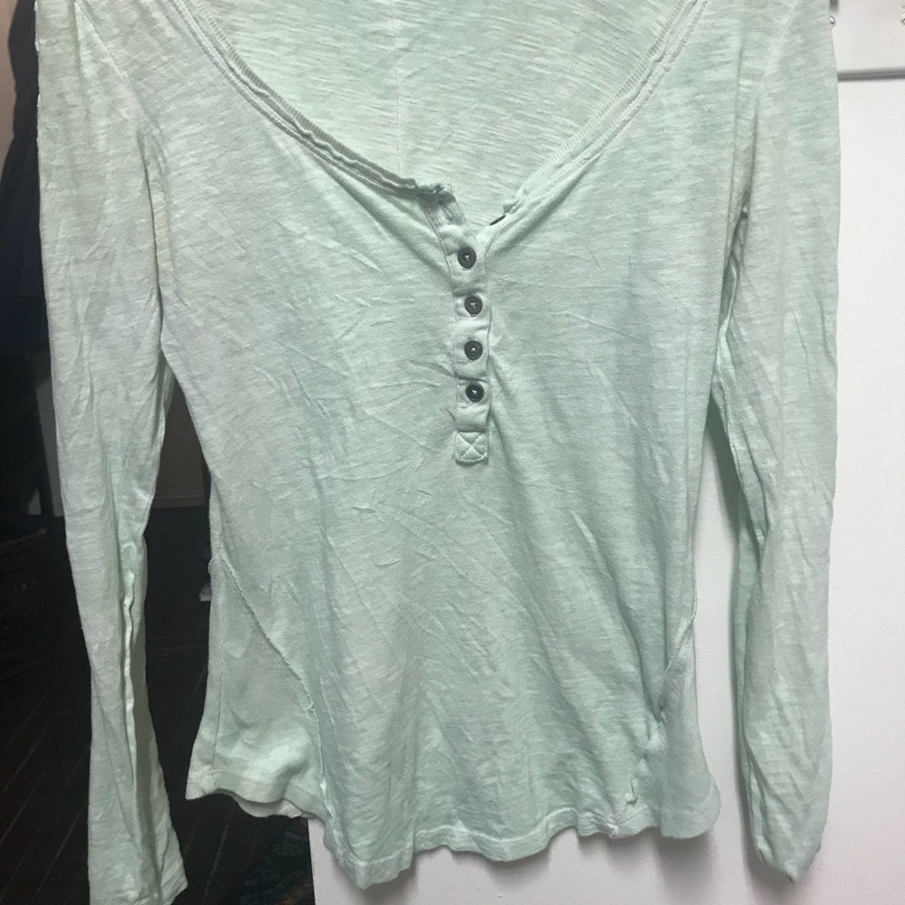 Light green Free People shirt with accented sleeve